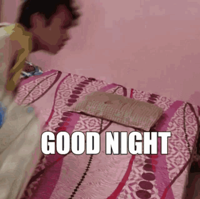 a man laying on a bed with the words good night written on the bottom
