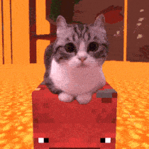 a cat is sitting on top of a red block in a video game .