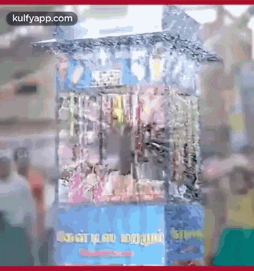 a picture of a popcorn machine with the words kulfyapp.com at the bottom