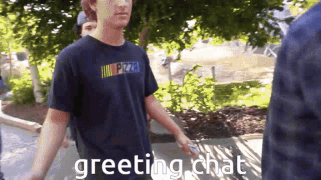 a man wearing a nascar shirt is greeting someone
