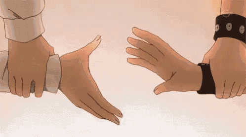 a couple of people are holding hands and one of them has a watch on their wrist .