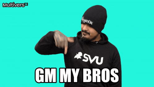 a man wearing a hoodie that says " gm my bros " on it