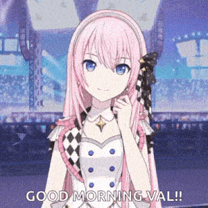 a girl with pink hair and blue eyes is standing in front of a crowd and saying good morning .