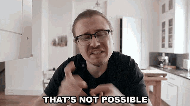 a man with glasses and a black shirt says that 's not possible
