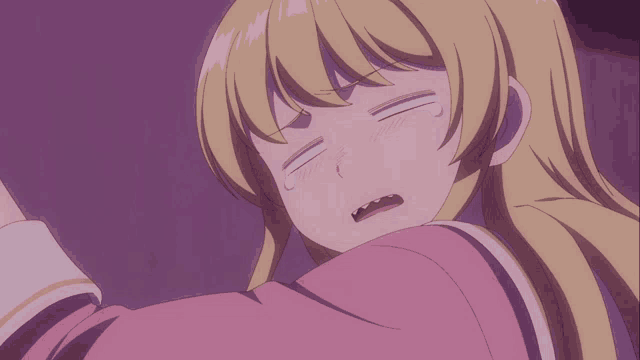 a girl with blonde hair is making a funny face with her eyes closed