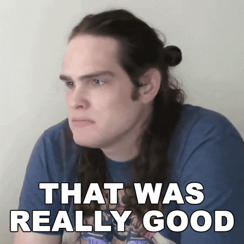 a man with long hair has the words that was really good above him