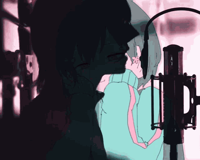 a girl in a green sweater is singing into a microphone while another girl looks on
