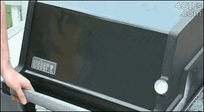 a weber grill with a thermometer on the side