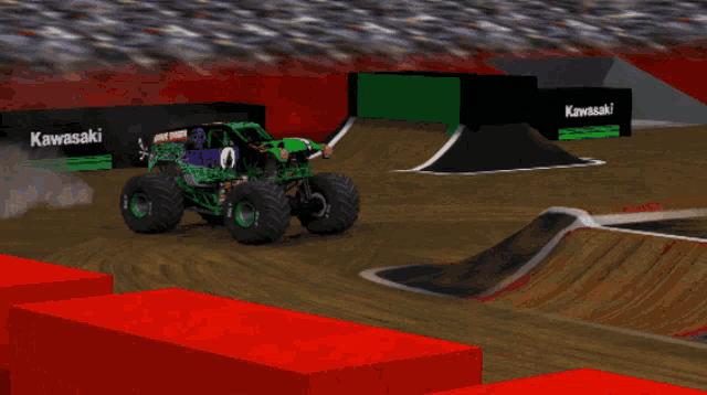 a monster truck is jumping over a ramp with a sign that says bkt