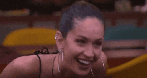 a close up of a woman 's neck and chest with a microphone .