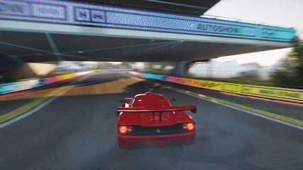 a red sports car is driving under a bridge that says autoshow on it