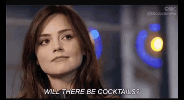 a woman says will there be cocktails in a blurry photo