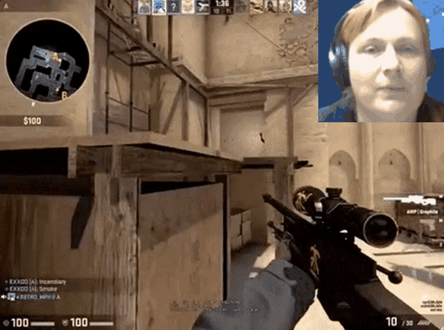 a man is holding a sniper rifle in front of a screen that says $ 100 on it