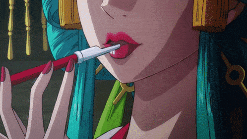 a close up of a woman 's mouth with a red lipstick sticking out of it