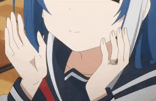 a girl with blue hair is wearing a ring on her finger and talking on a cell phone .