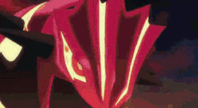 a close up of a red umbrella with a yellow stripe on the bottom .