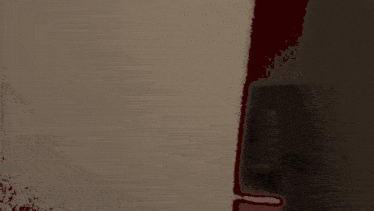a bloody hallway with a shadow of a person on the wall