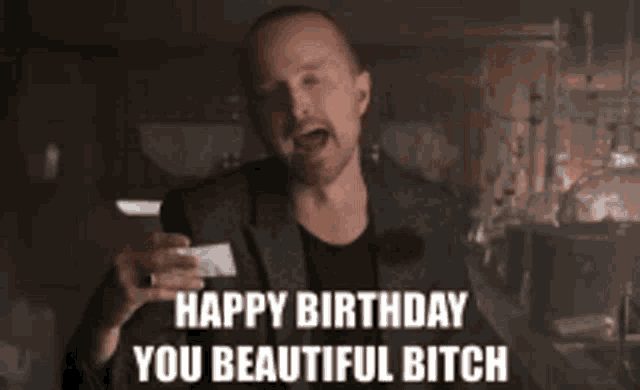 a man in a suit is giving the middle finger and says happy birthday you beautiful bitch