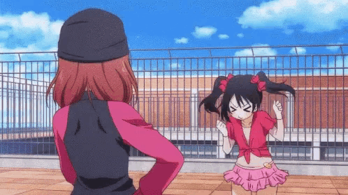 two anime girls are standing next to each other on a rooftop