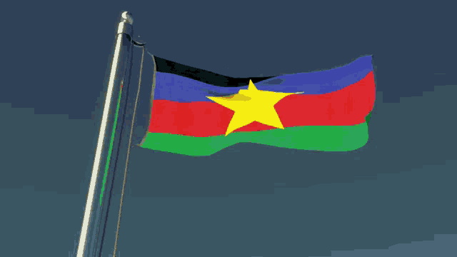 a colorful flag with a yellow star in the middle