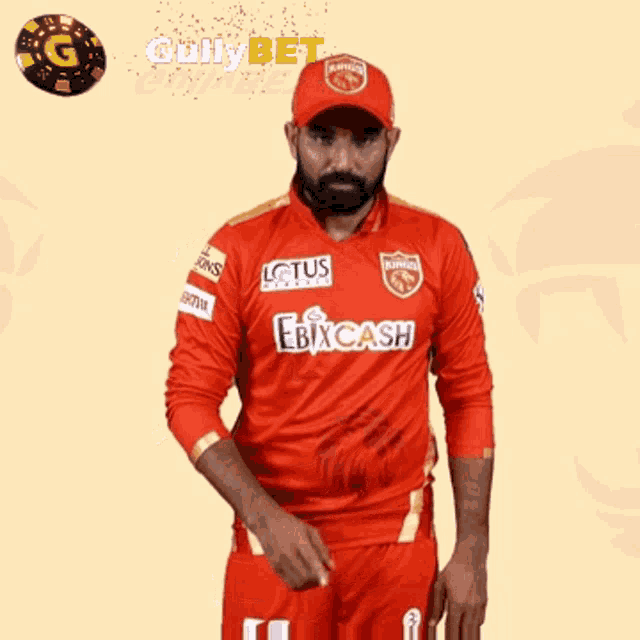 a man wearing a red jersey with the word cash on it