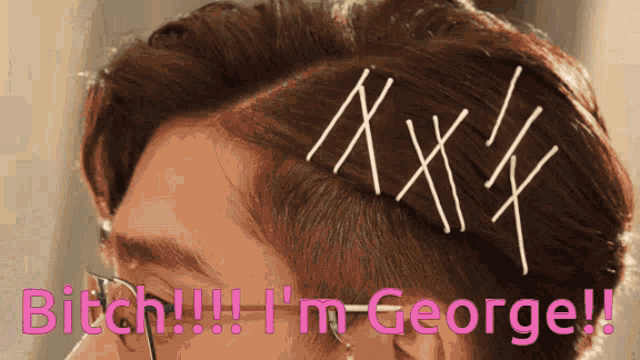 a close up of a person 's head with the words " bitch !!! i 'm george " written on it
