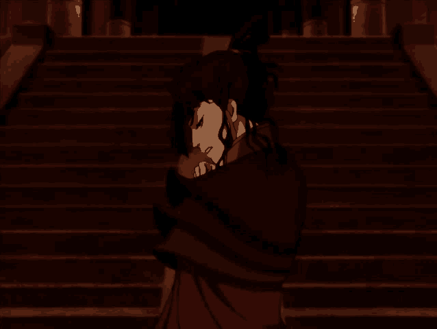 a woman in a red cape stands on a set of stairs