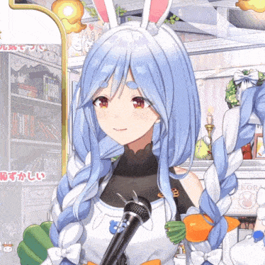 a girl with bunny ears is holding a microphone in her hand