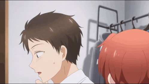 a man and a girl are standing next to each other in a room