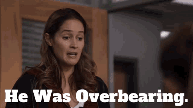a woman says " he was overbearing " in front of a man