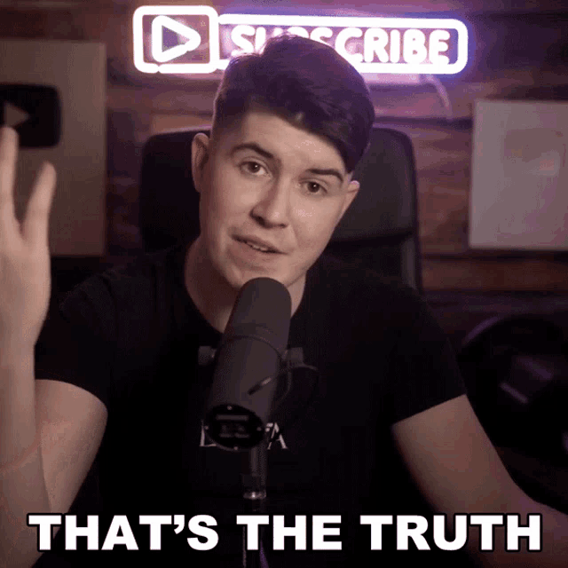 a man in front of a microphone with the words that 's the truth above him
