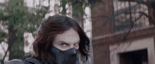 a close up of a man wearing a mask .