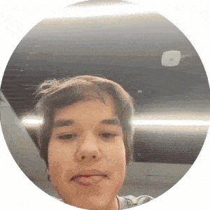 a young man is taking a selfie in a round frame