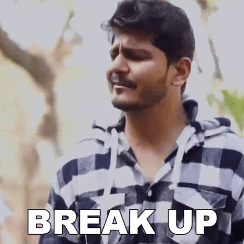 a man in a plaid shirt is making a funny face and saying break up