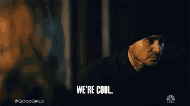 a man in a black hat says we 're cool in front of a woman