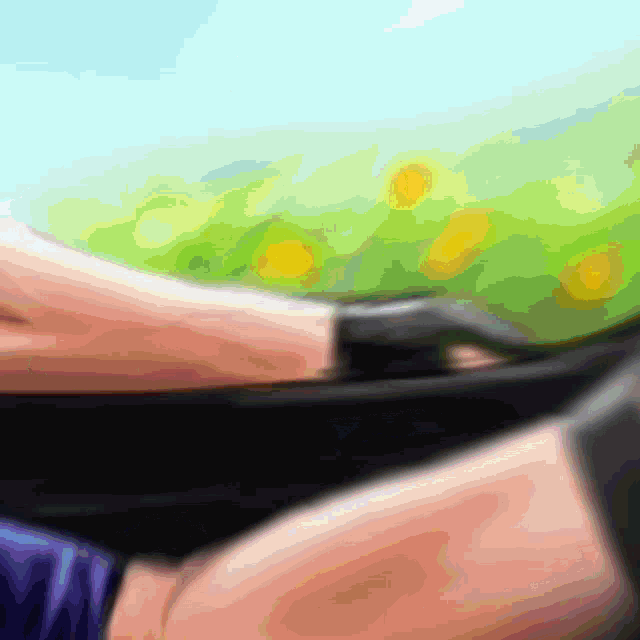a blurry picture of a person 's arm with a green background