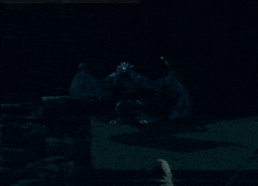 a screenshot of a video game shows a dragon coming out of the dark