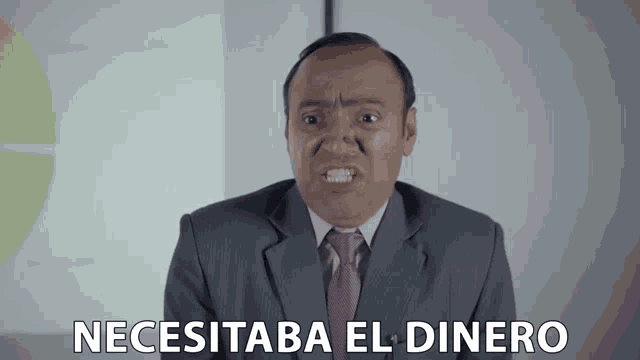 a man in a suit and tie says " necesitaba el dinero " in spanish
