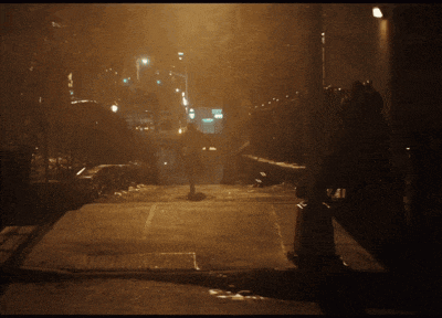 a person walking down a staircase at night