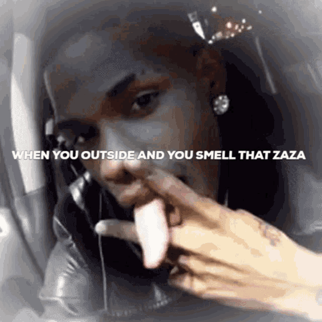 a man sticking his tongue out with the words " when you outside and you smell that zaza " below him