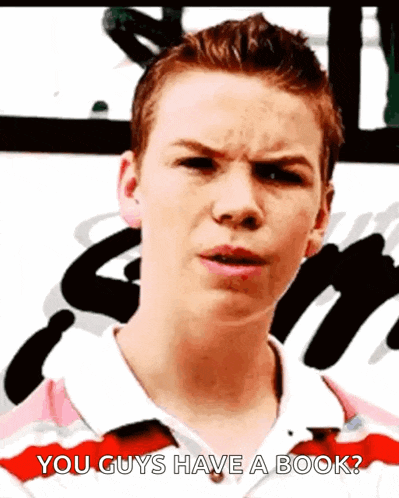 a young man in a pink and red striped shirt is asking if he guys have a book .