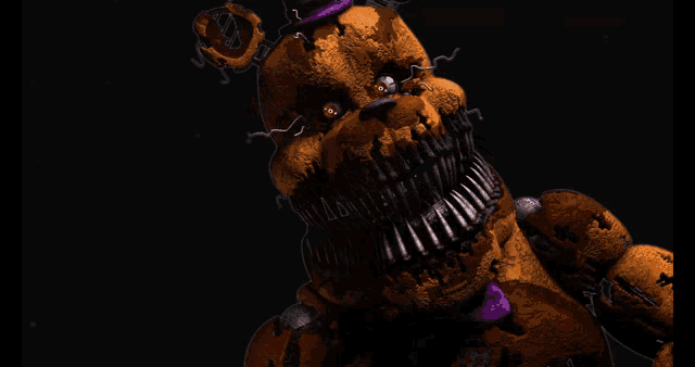 a close up of a teddy bear with a purple bow tie on it