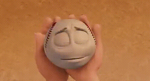 a baseball with a sad face on it