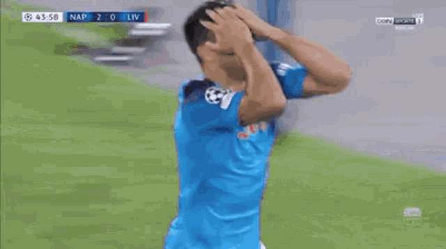 a soccer player wearing a blue shirt with the word lete on it is celebrating a goal .