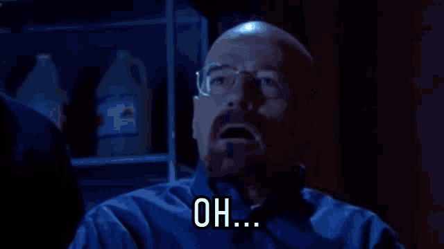 a bald man with glasses and a beard says " oh "