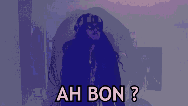 a man with long hair and a hat says ah bon ?