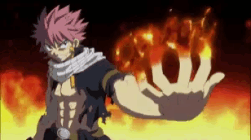 a man is holding a fireball in his hand in front of a fire background .