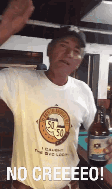 a man wearing a shirt that says i caught the qvc local