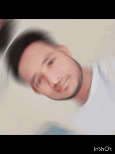 a blurry picture of a man 's face with the words ' inshot ' on the bottom