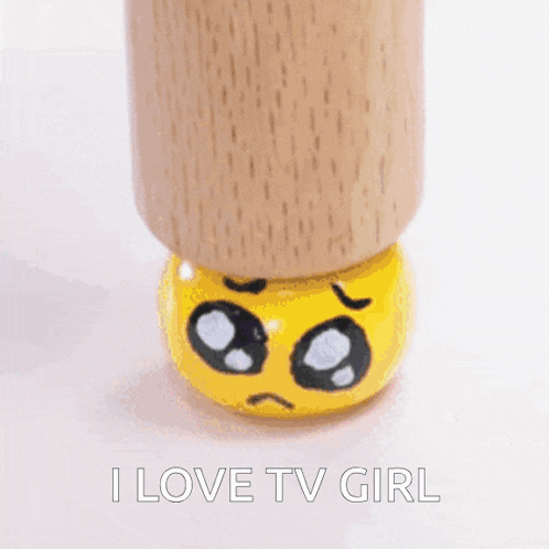 a wooden table leg with a sad face painted on it